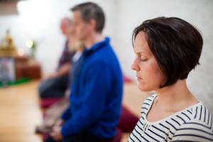 Retreatants meditating